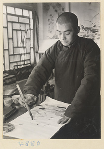 Artist making a scroll painting