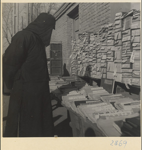 Customer at a book stall at New Year's