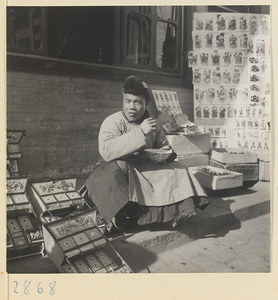 Street vendor selling paper-cuts at New Year's