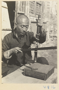 Furniture-maker drilling a hole in a box, Furniture Street, Peking