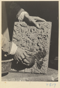 Furniture-maker staining a wooden relief panel, Furniture Street, Peking