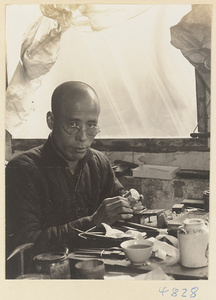 Silversmith at a workbench in a workshop