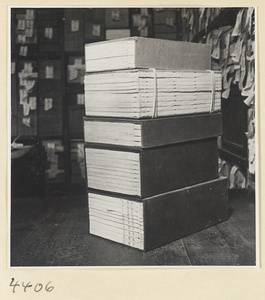 Stack of books with multiple volumes in a bookshop
