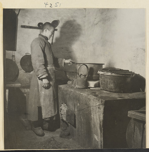 Cook working at a stove
