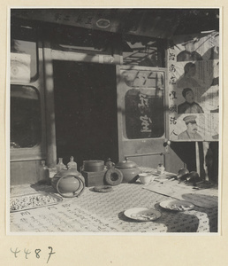 Street doctor's stand showing posters picturing recovered patients