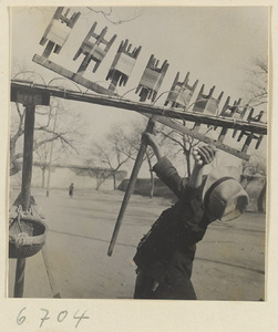 Boys spinning silk outdoors