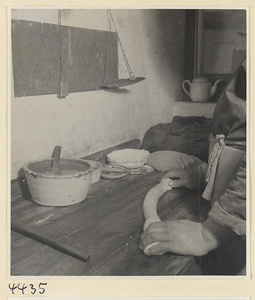 Kitchen of Niu Rou Wan, a Muslim grilled-beef restaurant, showing a chef rolling dough