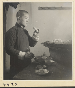 Kitchen of Niu Rou Wan, a Muslim grilled-beef restaurant, showing a chef working at a grill