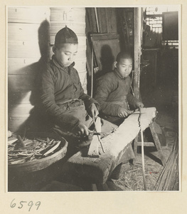 Two boys cutting slats for bamboo steamers in a workshop