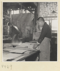 Man assembling a cardboard case for a book