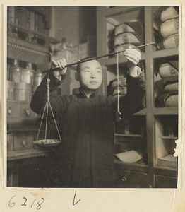 Tobacco shop interior showing a man weighing tobacco with a scale