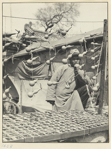 Street vendor selling gourds at his stand