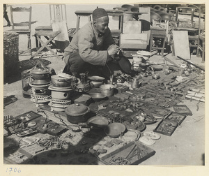 Street vendor selling second-hand household goods at Tianqiao Market