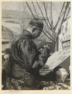 Man at a New Year's curio market at Liuli Chang