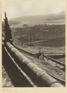 View from a temple roof at the Yun'gang Caves showing surrounding fields and hills