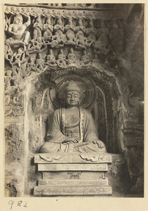 Interior detail of a cave temple at Yun'gang showing a niche with a seated Buddha