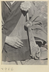 Daoist priest holding a carved ru yi sceptre on Hua Mountain