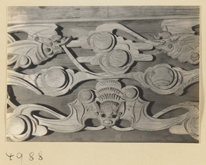 Wooden cutout with bat and cloud motifs at a Daoist temple on Hua Mountain