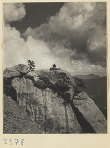 Daoist temple building Qi ting on an inaccessible rockhead below East Peak of Hua Mountain with Qinling Mountains in background