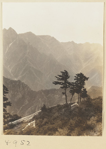 Daoist temple building on West Peak of Hua Mountain with Qinling Mountains in background