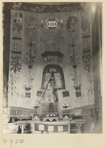 Altar with a statue and embroidered cloth with inscription in a Daoist temple on Hua Mountain