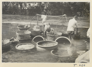 Village women washing clothes in the river at Ji'nan