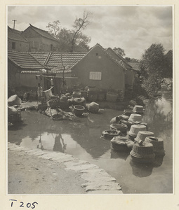 Village women washing clothes in the river at Ji'nan