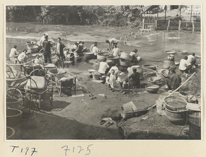 Village women washing clothes in the river at Ji'nan