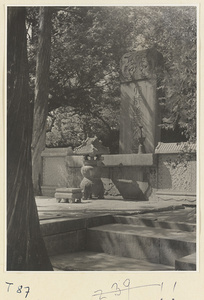 Tomb of Confucius with inscribed stone stela, incense burner, and candlestick at Zhi sheng lin in Qufu