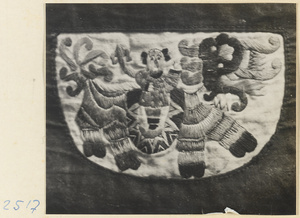 Embroidered purse from a village on the Shandong coast with design showing a human figure mounted on a dragon