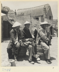 Three men in a village on the Shandong coast