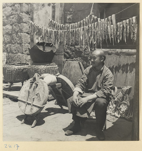 Man selling dried fish in a village on Shandong coast