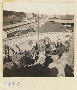 Funeral procession with umbrellas and banners