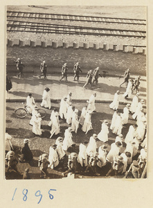 Members of a funeral procession dressed in white, Chaoyangmen (朝阳门), Beijing