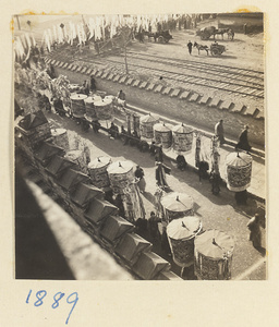 Funeral procession with umbrellas and elegaic banners