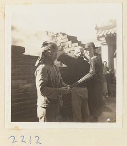 Pilgrim holding burning incense on Miaofeng Mountain