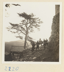 Pilgrim being carried down Miaofeng Mountain in a sedan chair