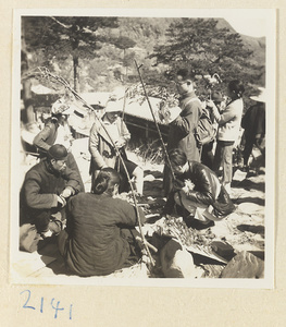 Pilgrims with peach-wood walking sticks buying souvenirs on Miaofeng Mountain