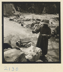 Man with incense for pilgrims on Miaofeng Mountain