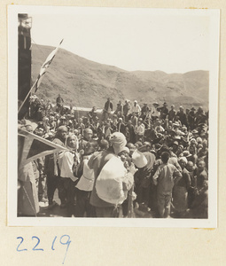 Pilgrims with flags on the pagoda terrace on Miaofeng Mountain