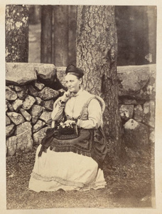 Mrs. Wadman sitting in chair beneath tree, on temple grounds near Ningbo