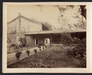 Walkway to private entrance in brick wall at unidentified location in Canton