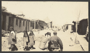 Muslim women and man in a street in Weizhou, Ningxia