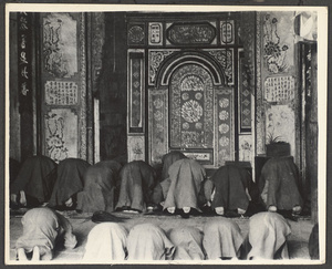 Men and boys praying in a mosque