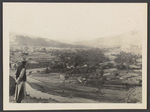 Tsinghai or Koko Nor.  Looking up the Ch'uan K'o Valley, a Moslem stronghold, toward Payung Rung.  Mr. Harris in foreground.