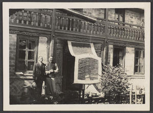 Sining, capital of Tsinghai or Koko Nor.  Dr. Z. & Mr. Learner in front of the Learner home.