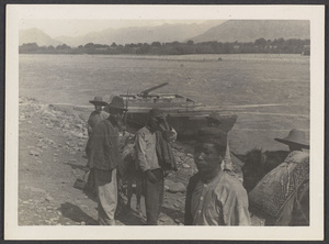 Yellow River Valley again.  Our ferry.  Moslem boatmen with round hats.