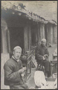 Kuyuan, Kansu.  Home industry.  Crocheting their own caps.