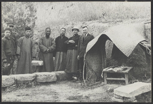 Kung Men Chen, Kansu.  His private cemet[e]ry.  Ahung-in-charge 3rd from right.