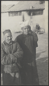 Along the highways and byways of East Kansu. A 'flour bag' hat.